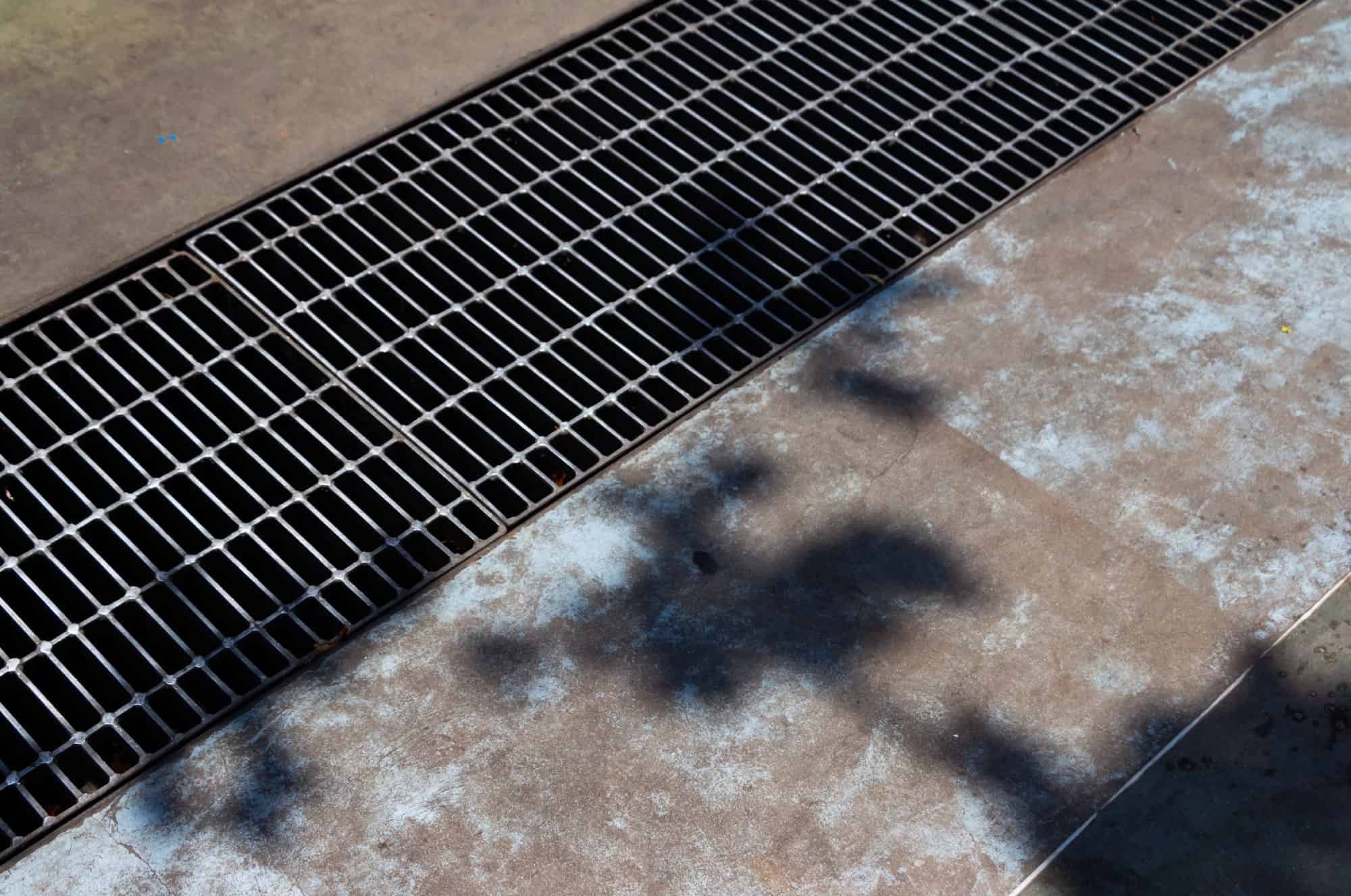 Metal grid on the sewerage canal