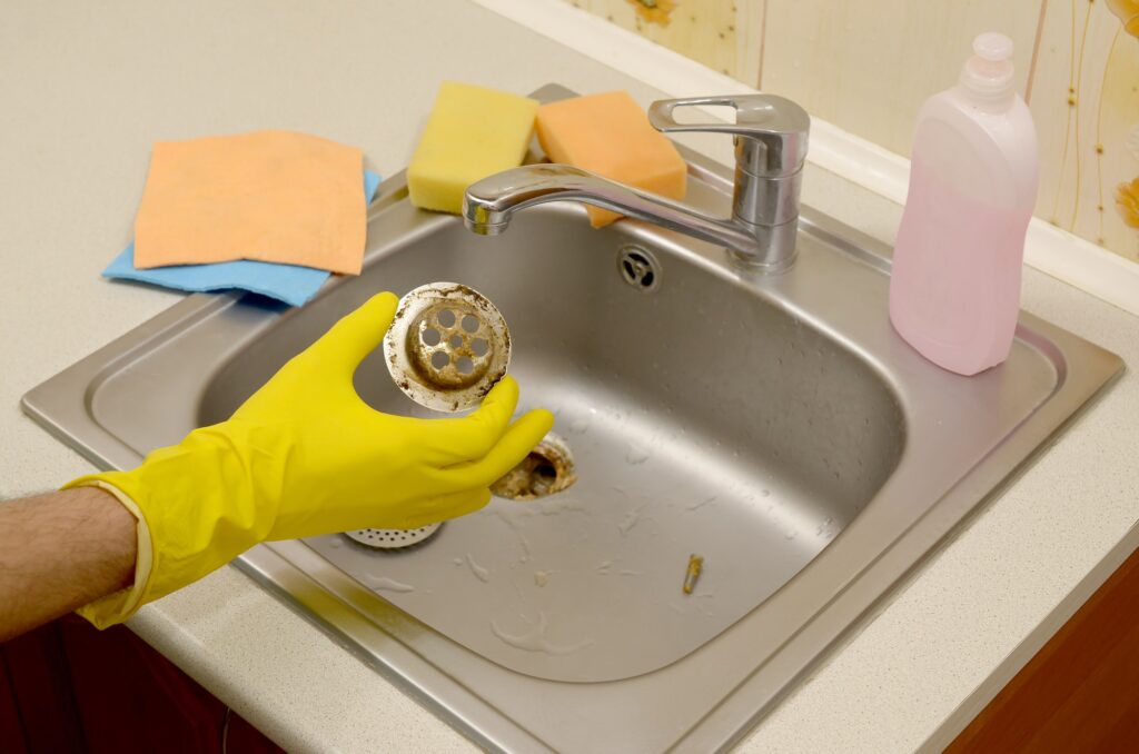 Sink Stopper Cleaner waste in the plughole protector of a kitchen sink